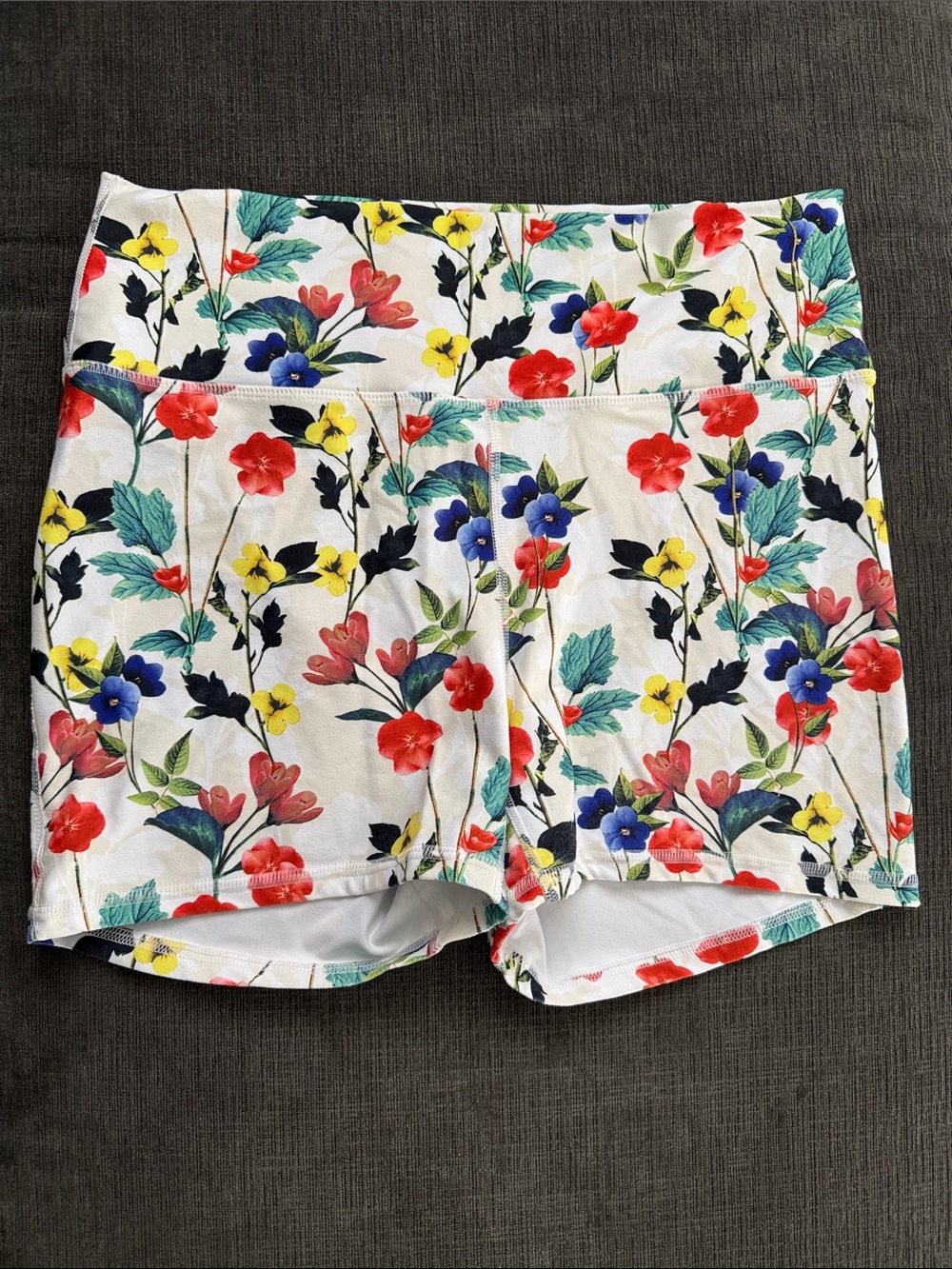 Fabletics White Floral Bike Shorts with Red, Blue, Yellow & Green Accents